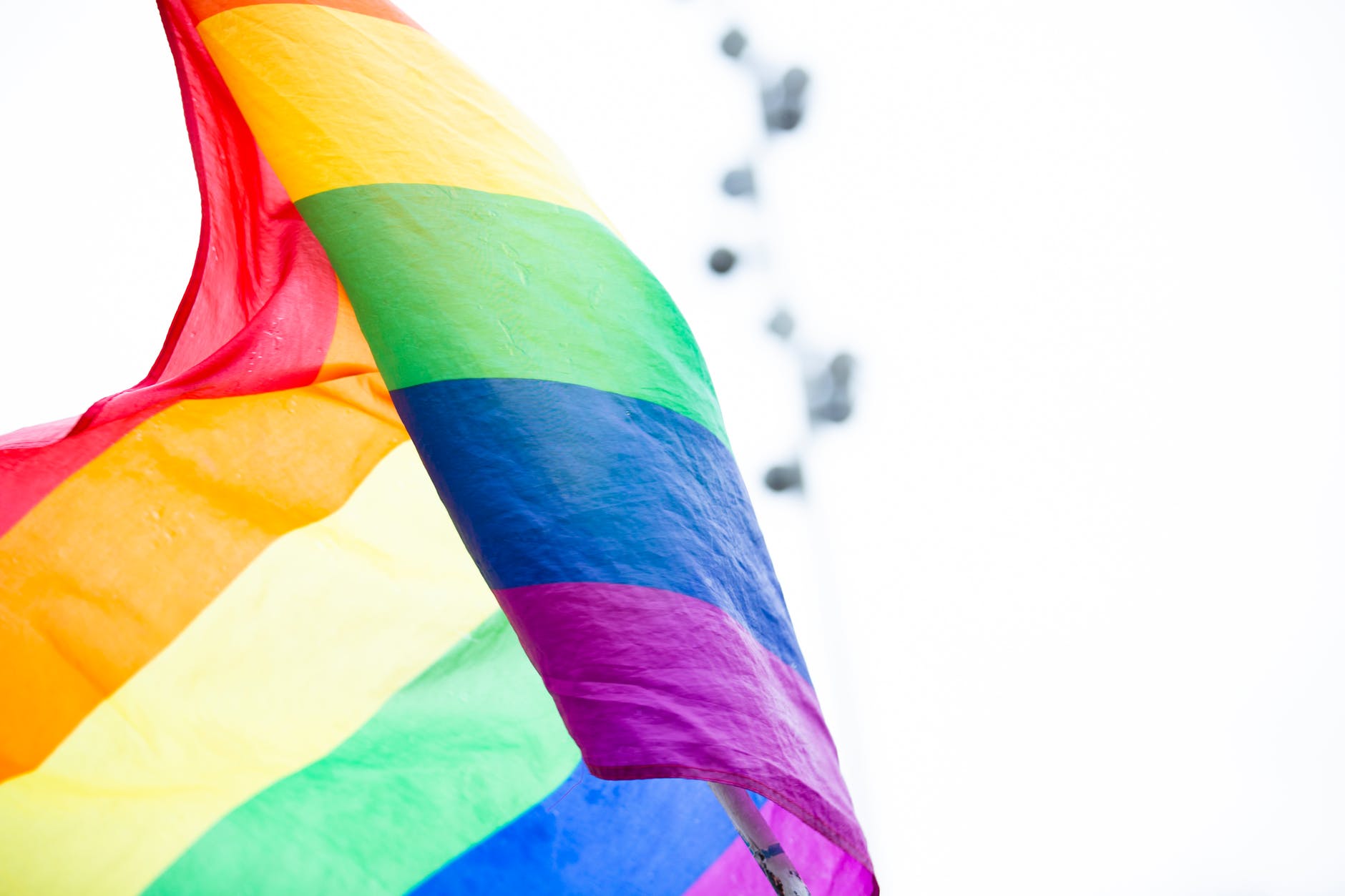selective focus photography of waving pride flag